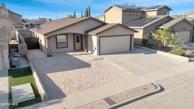 14197 Ranier Point Dr, El Paso, TX 79938 - ranch-style house featuring stucco siding, concrete driveway, a garage, a residential view, and covered porch