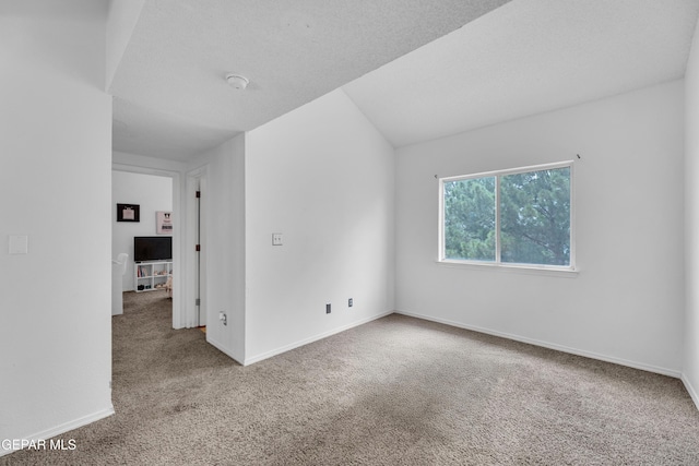 3033 Tierra Kino Way, El Paso, TX 79938 - empty room with carpet floors, a smoke detector, and lofted ceiling