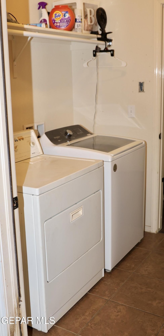 14251 Rattler Point Dr, El Paso, TX 79938 - laundry room featuring separate washer and dryer and dark tile patterned flooring