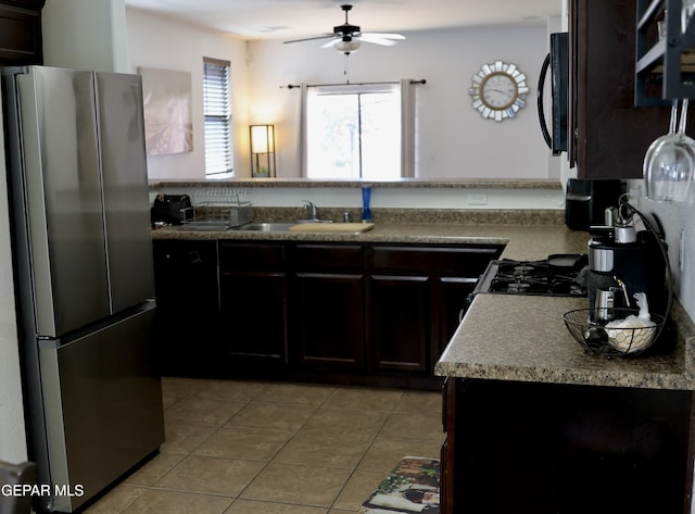 14251 Rattler Point Dr, El Paso, TX 79938 - kitchen with freestanding refrigerator, a ceiling fan, light tile patterned flooring, black microwave, and a peninsula