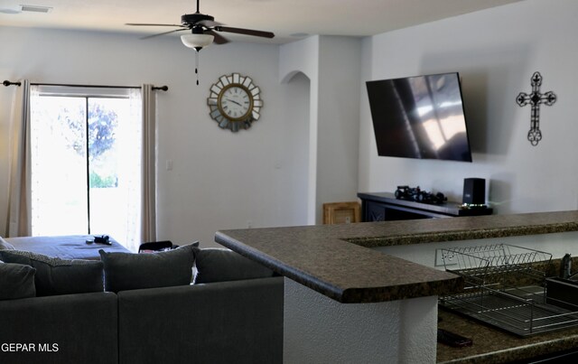 14251 Rattler Point Dr, El Paso, TX 79938 - living area featuring ceiling fan and arched walkways