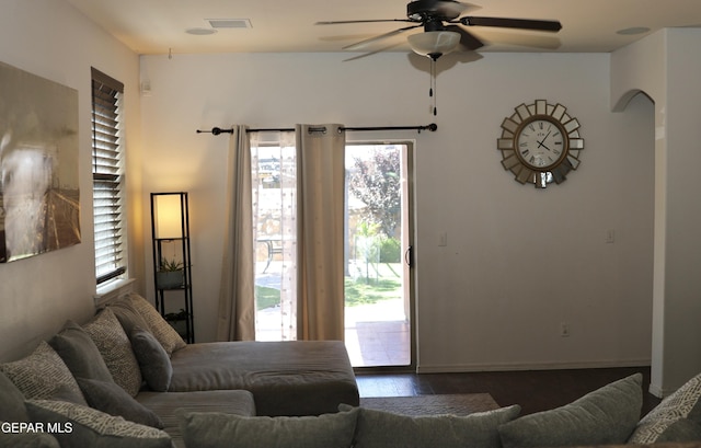 14251 Rattler Point Dr, El Paso, TX 79938 - living room featuring a ceiling fan, healthy amount of natural light, wood finished floors, and arched walkways
