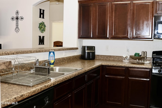 14251 Rattler Point Dr, El Paso, TX 79938 - kitchen featuring black appliances, arched walkways, and dark brown cabinetry