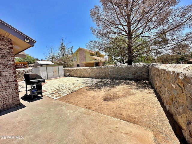 800 Derrickson Dr, El Paso, TX 79912 - fenced backyard with a shed, area for grilling, and a patio