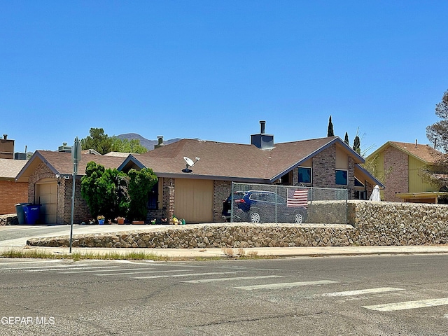 800 Derrickson Dr, El Paso, TX 79912 - view of front of property with a garage, brick siding, and concrete driveway