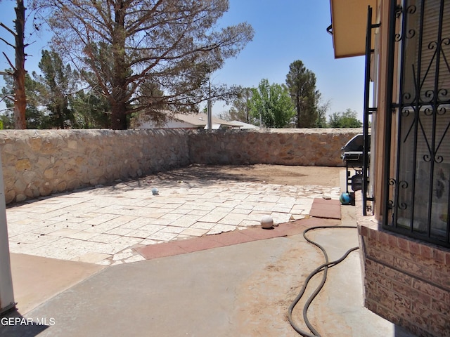 800 Derrickson Dr, El Paso, TX 79912 - fenced backyard with a patio area and grilling area