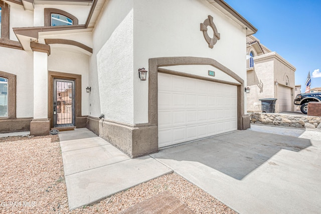 401 Everlook Ln, Horizon City, TX 79928 - view of front facade featuring concrete driveway and stucco siding