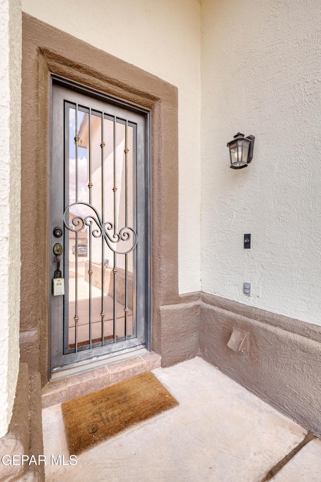 401 Everlook Ln, Horizon City, TX 79928 - view of exterior entry with stucco siding