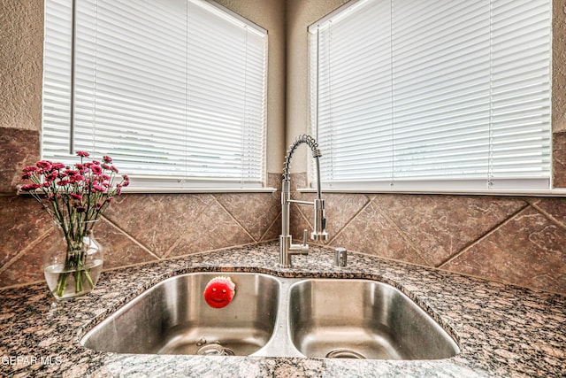 401 Everlook Ln, Horizon City, TX 79928 - kitchen view of tasteful backsplash and dark stone countertops