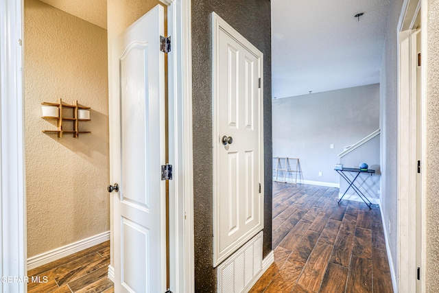 401 Everlook Ln, Horizon City, TX 79928 - corridor with dark wood-style flooring and a textured wall