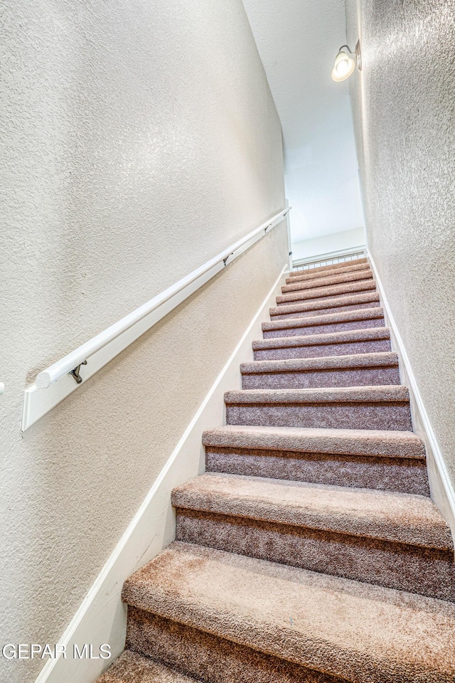 401 Everlook Ln, Horizon City, TX 79928 - stairway with a textured wall