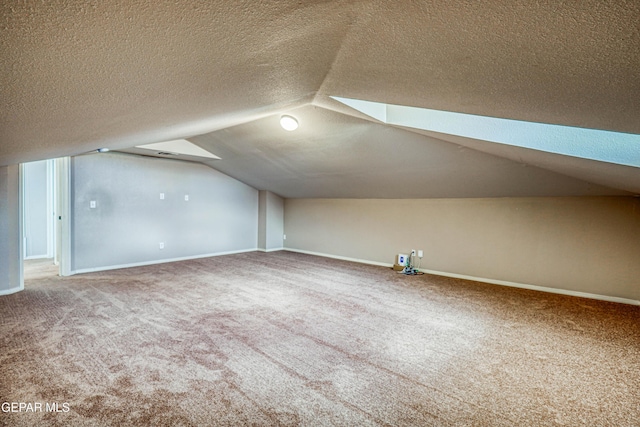 401 Everlook Ln, Horizon City, TX 79928 - additional living space featuring carpet flooring, vaulted ceiling, and a textured ceiling