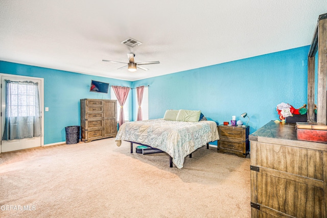 401 Everlook Ln, Horizon City, TX 79928 - bedroom with multiple windows, carpet, and ceiling fan