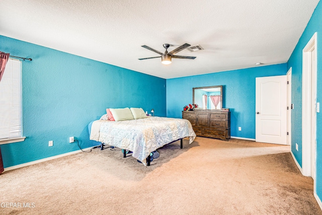 401 Everlook Ln, Horizon City, TX 79928 - bedroom with carpet, a textured ceiling, ceiling fan, and a textured wall