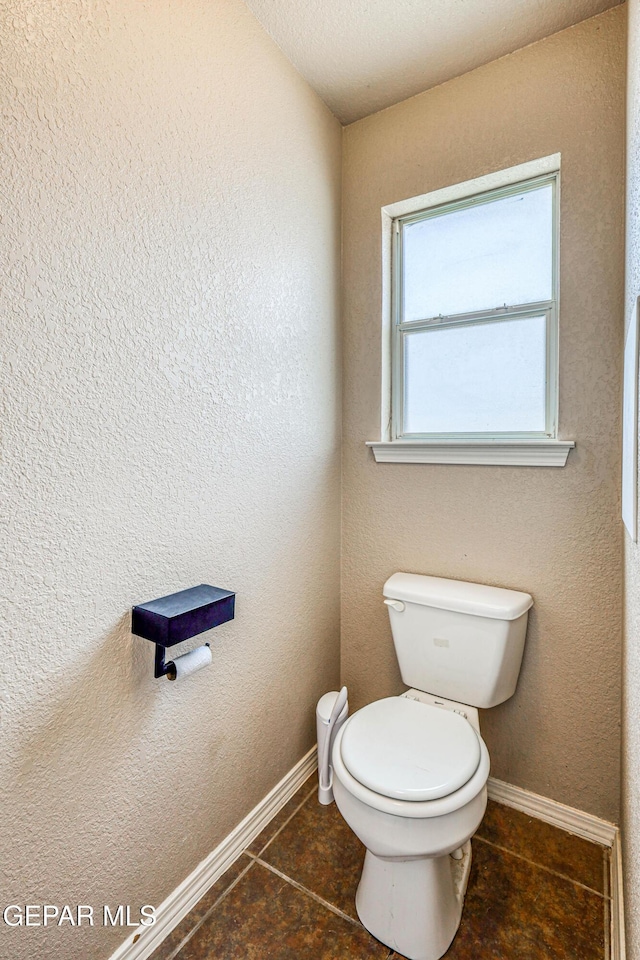 401 Everlook Ln, Horizon City, TX 79928 - bathroom featuring toilet and tile patterned floors