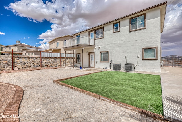 401 Everlook Ln, Horizon City, TX 79928 - rear view of property with a balcony, stucco siding, a fenced backyard, and a patio