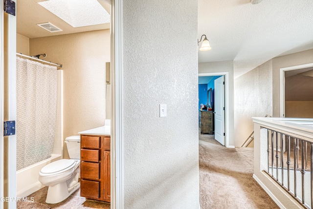 401 Everlook Ln, Horizon City, TX 79928 - full bathroom featuring a textured wall, a skylight, vanity, shower / bath combination with curtain, and a textured ceiling