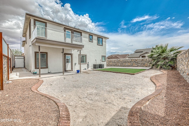 401 Everlook Ln, Horizon City, TX 79928 - back of house featuring a balcony, a patio area, and a fenced backyard