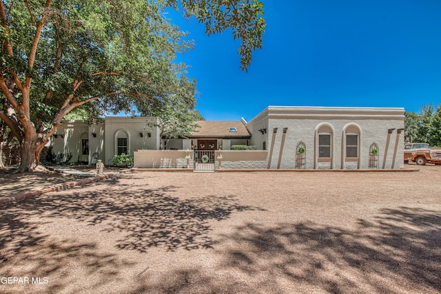 5430 Davis Cup Ct, El Paso, TX 79932 - rear view of house with a gate and stucco siding