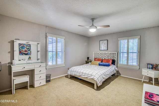 5430 Davis Cup Ct, El Paso, TX 79932 - bedroom with carpet flooring, a textured ceiling, and a ceiling fan