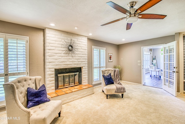 5430 Davis Cup Ct, El Paso, TX 79932 - sitting room featuring carpet, a brick fireplace, ceiling fan, recessed lighting, and a textured ceiling