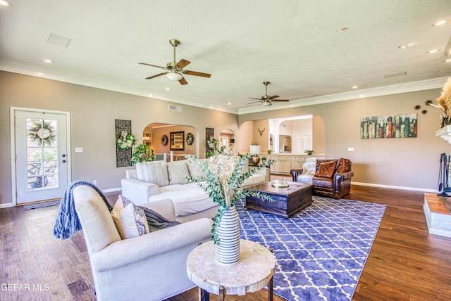 5430 Davis Cup Ct, El Paso, TX 79932 - living area featuring arched walkways, ceiling fan, wood finished floors, recessed lighting, and ornamental molding