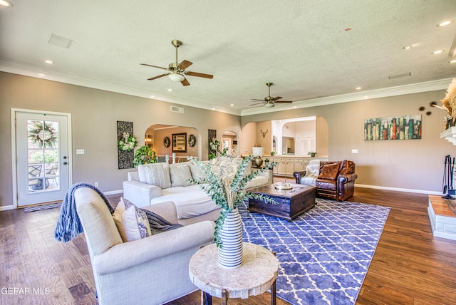 5430 Davis Cup Ct, El Paso, TX 79932 - living room featuring arched walkways, ceiling fan, wood finished floors, recessed lighting, and a textured ceiling