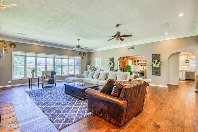 5430 Davis Cup Ct, El Paso, TX 79932 - living room featuring arched walkways, ceiling fan, wood finished floors, a textured ceiling, and recessed lighting
