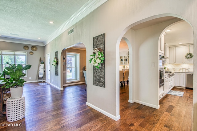 5430 Davis Cup Ct, El Paso, TX 79932 - entryway featuring crown molding, dark wood-style floors, a textured ceiling, and recessed lighting
