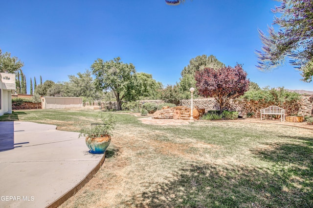 5430 Davis Cup Ct, El Paso, TX 79932 - view of green lawn with a patio area