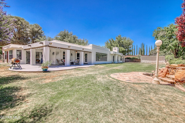 5430 Davis Cup Ct, El Paso, TX 79932 - back of property featuring stucco siding, a patio, and a yard