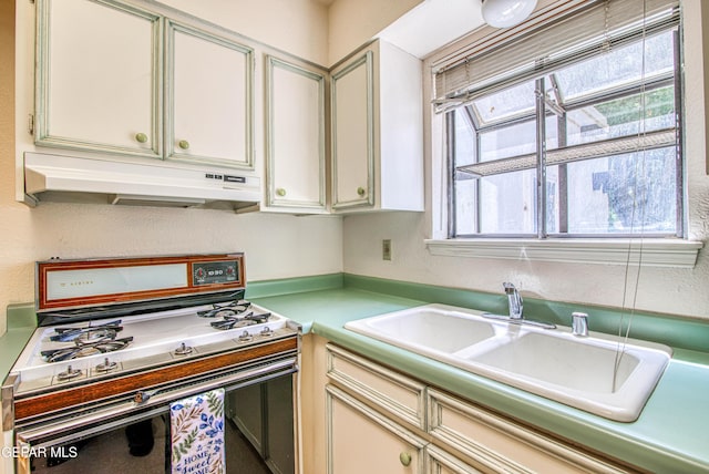 5430 Davis Cup Ct, El Paso, TX 79932 - kitchen featuring gas range oven, extractor fan, and light countertops