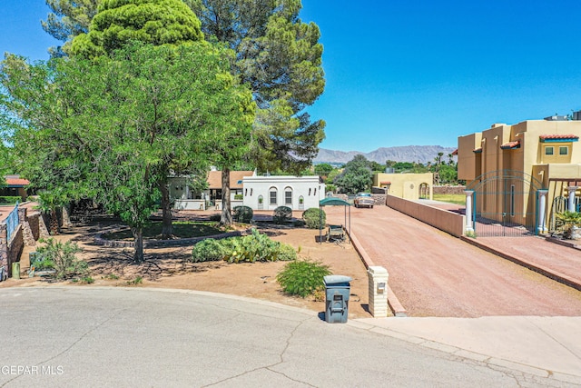 5430 Davis Cup Ct, El Paso, TX 79932 - view of front of home featuring a mountain view, stucco siding, and dirt driveway