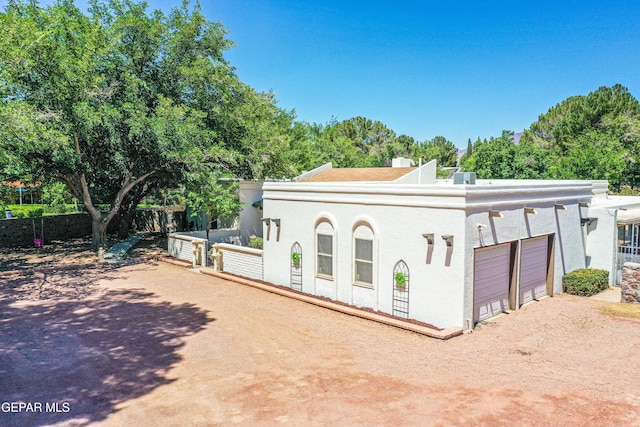 5430 Davis Cup Ct, El Paso, TX 79932 - view of front of property with an attached garage, driveway, and stucco siding