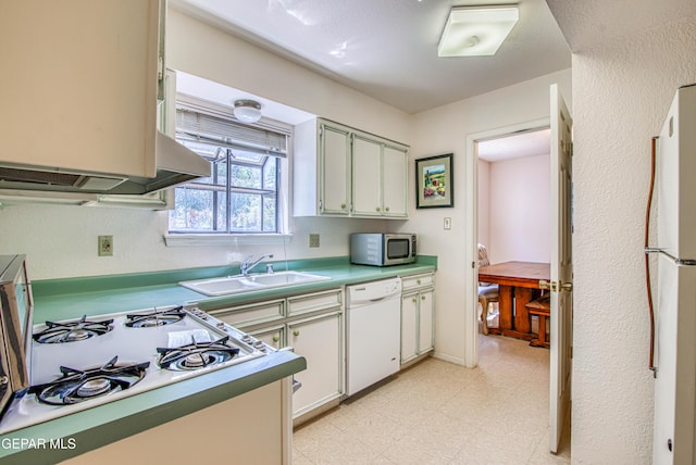 5430 Davis Cup Ct, El Paso, TX 79932 - kitchen with white appliances, light floors, and light countertops