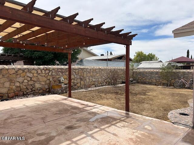 9728 El Tepeyac Ave, El Paso, TX 79927 - fenced backyard with a patio area