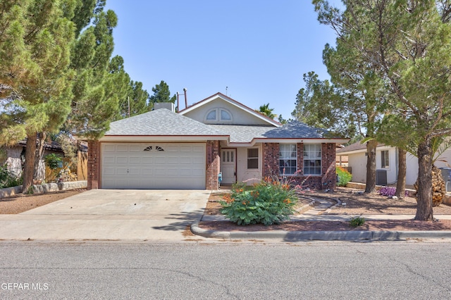 11969 Oak Abbey Ct, El Paso, TX 79936 - view of front of property with an attached garage, brick siding, concrete driveway, and a shingled roof