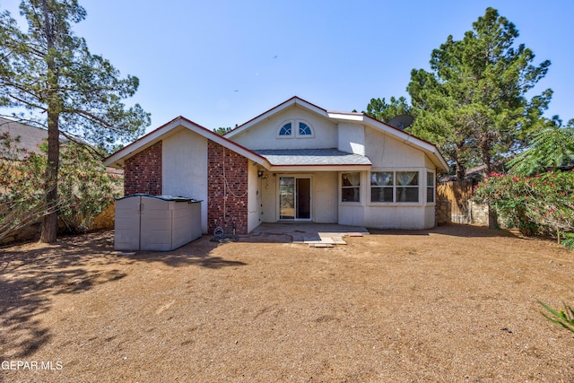 11969 Oak Abbey Ct, El Paso, TX 79936 - view of front of house with brick siding and a patio area