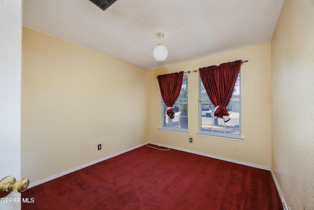 11969 Oak Abbey Ct, El Paso, TX 79936 - spare room with dark carpet and a textured ceiling