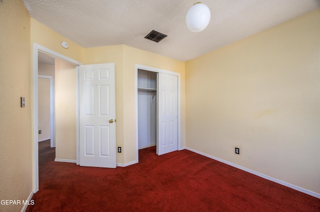 11969 Oak Abbey Ct, El Paso, TX 79936 - unfurnished bedroom with carpet flooring, a closet, and a textured ceiling