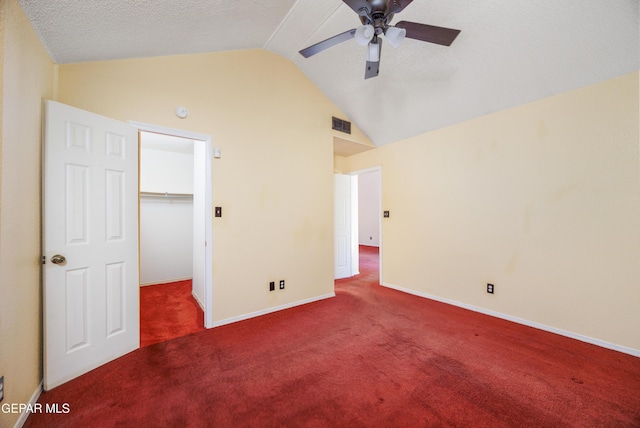 11969 Oak Abbey Ct, El Paso, TX 79936 - unfurnished bedroom featuring carpet, lofted ceiling, a spacious closet, a ceiling fan, and a closet