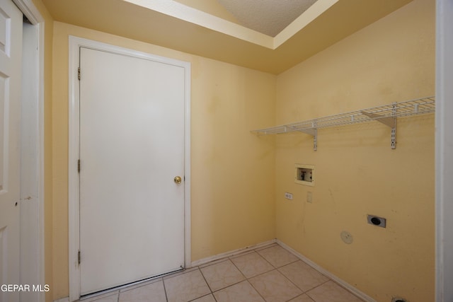 11969 Oak Abbey Ct, El Paso, TX 79936 - laundry room with hookup for an electric dryer, washer hookup, and light tile patterned floors