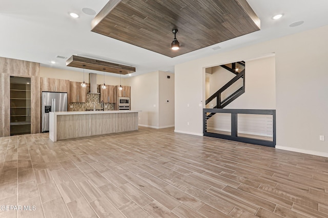 14904 John Mcneely Ave, El Paso, TX 79938 - unfurnished living room with a raised ceiling, light wood finished floors, wooden ceiling, recessed lighting, and stairway