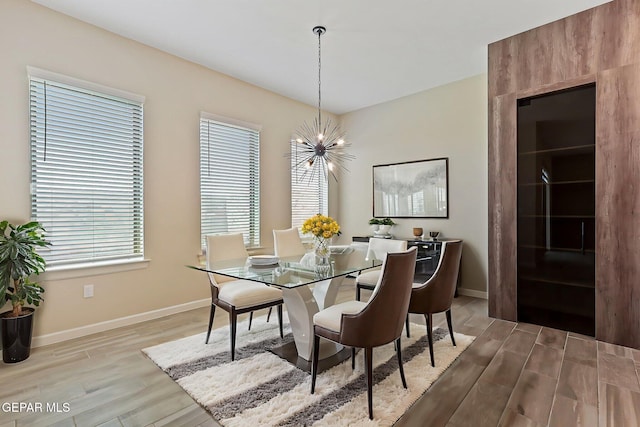 14904 John Mcneely Ave, El Paso, TX 79938 - dining space featuring a chandelier and light wood-type flooring