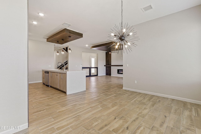 14904 John Mcneely Ave, El Paso, TX 79938 - kitchen with hanging light fixtures, open floor plan, stainless steel dishwasher, light wood-style flooring, and recessed lighting