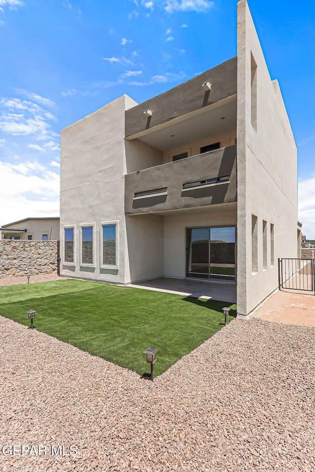 14904 John Mcneely Ave, El Paso, TX 79938 - back of house with a patio area, stucco siding, and a balcony