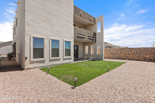 14904 John Mcneely Ave, El Paso, TX 79938 - back of property with a patio and stucco siding
