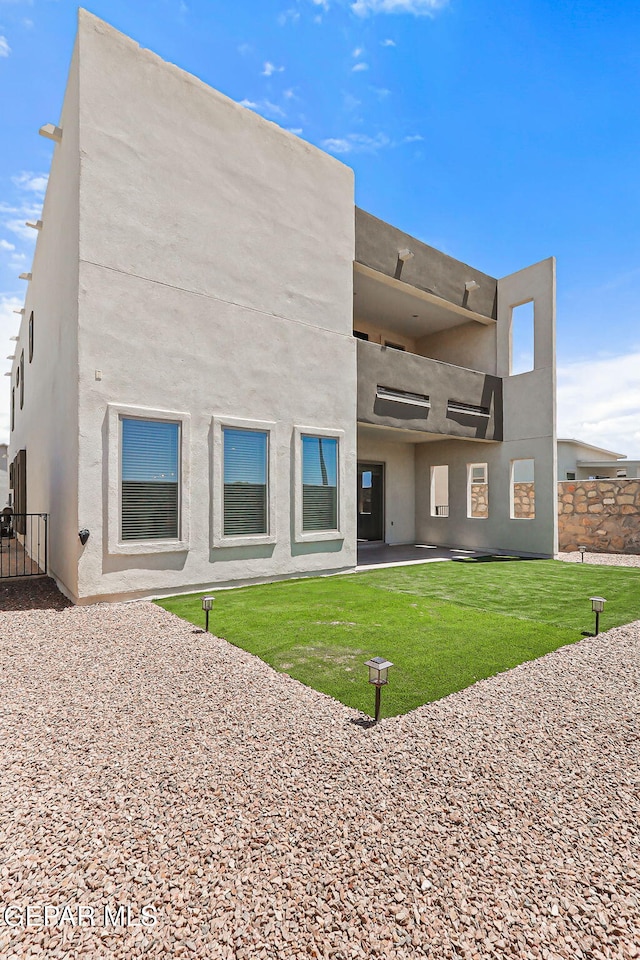 14904 John Mcneely Ave, El Paso, TX 79938 - rear view of house featuring a patio area and stucco siding