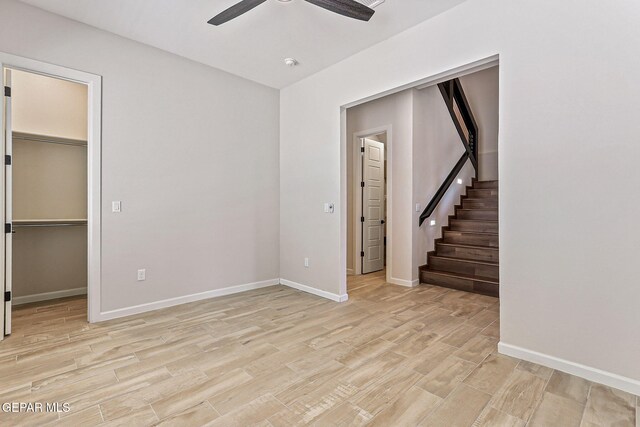 14904 John Mcneely Ave, El Paso, TX 79938 - spare room featuring ceiling fan, light wood-style flooring, stairs, and a smoke detector