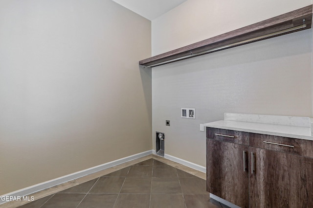 14904 John Mcneely Ave, El Paso, TX 79938 - washroom with electric dryer hookup, hookup for a washing machine, and dark tile patterned flooring